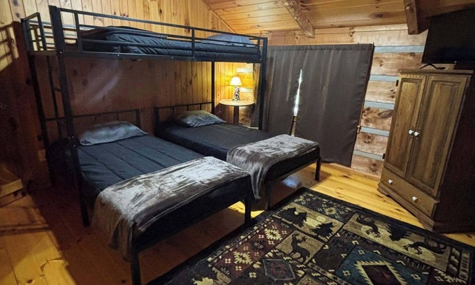 Lansing Cabin | The Boatright Retreated nestled on the river.