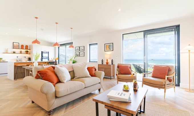 Widemouth Bay House | The Lighthouse is an end of terrace four bedroomed seafront retreat with a hot tub and incredible vi