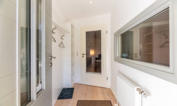 Wyk auf Foehr Apartment | The location is heavenly quiet on the outskirts of the city, surrounded by green trees.