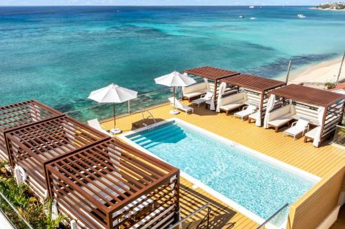 West Bay Apartment | The Sands #1 - New 7Mile Beach Condo with Rooftop Pool & Luxe Interiors
