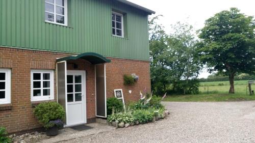 Tarp House | Thomsen - familienfreundliche Ferienwohnung mit großem Garten