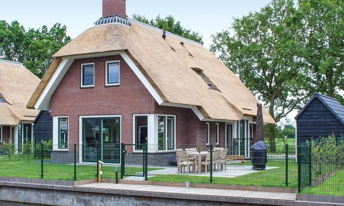 Idskenhuizen House | Villa in Friesland with Waterfront Garden