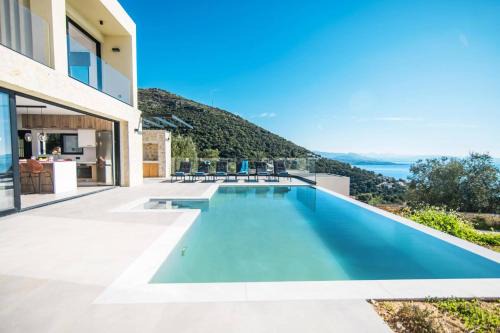 Petaleia Villa | Villa Nissaki View 2 by Villa Plus