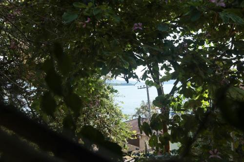 Sambaqui House | Vista para o mar junto a natureza AV3740