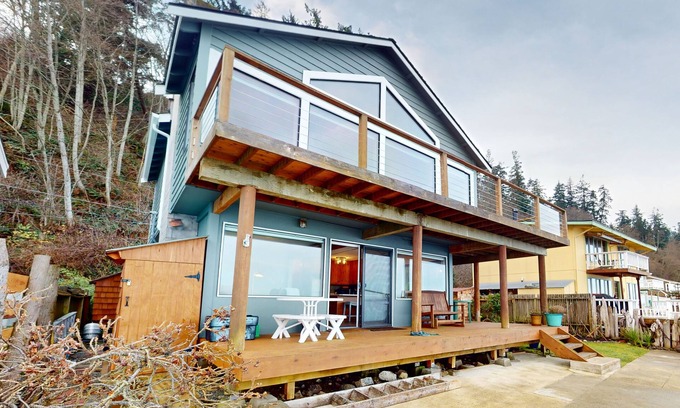 Langley House | Waterfront home with views, deck and open concept living