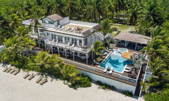Tar Bay Villa | Zen Exuma: Stunning Beachfront Villa w/NEW Rooftop Lounge, Spa, Cabana & Pool!