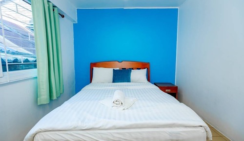 Standard room with Fan, Shared bathroom and King Bed.