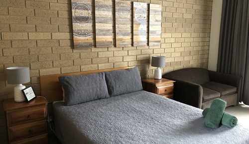 Room 21: Queen Deluxe Room with 50 inch Smart TV located on First Floor