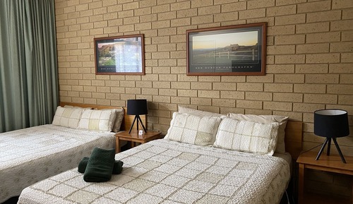 Room 7: Deluxe Two Queens with 50 inch Smart TV located on Ground Floor
