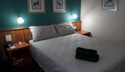 Room 1: Queen Standard Room with 50 inch Smart TV located on Ground Floor