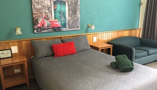 Room 2: Queen Standard Room with 50 inch Smart TV located on Ground Floor