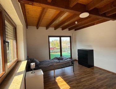 Four-Bedroom Apartment with Balcony 