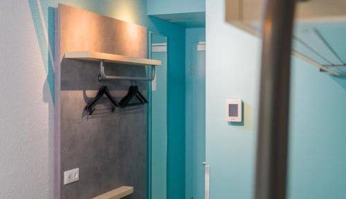 Small twin room with private bathroom and toilet