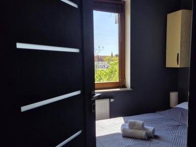 One-Bedroom Apartment with Balcony and City View