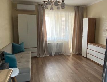 One-Bedroom Apartment with Balcony and City View