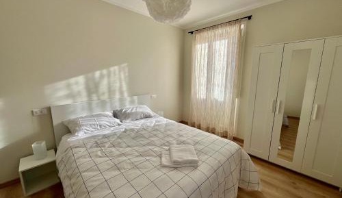 One-Bedroom Apartment with Balcony and City View