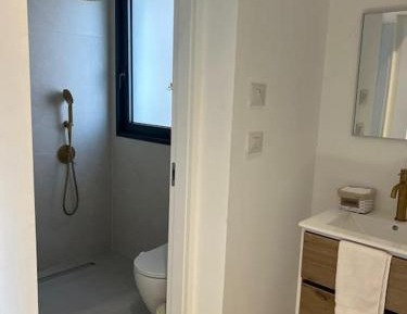 Three-Bedroom Apartment with Harbor View
