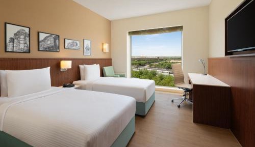 Premium Twin Room (15% Discount on food & soft beverage at Kava Restaurant, Happy Hours (Buy 1 Get 1) on IMFL beverages at the BAR)