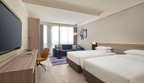 Twin Room with Sofa Bed and Garden View