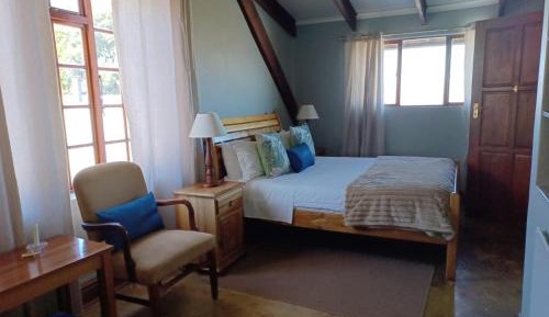Upstairs Standard Queen with a mountain view