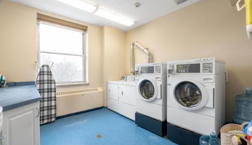 Queen Bed with Shared Bathroom