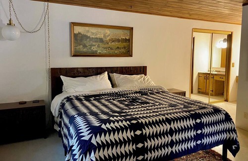 Lake Cavanaugh Cabin | Charming Waterfront Mid Century Waterfront Cabin w/ Hot Tub + Breathtaking Views