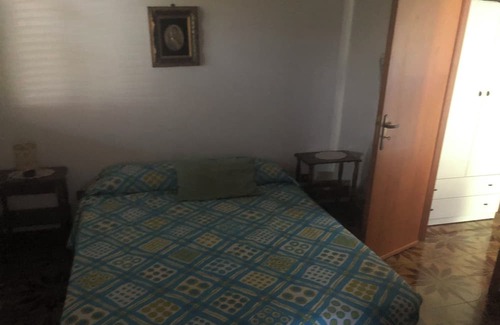 Partanna House | White house apartment with garden