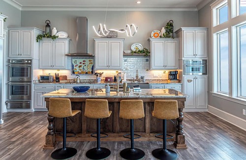 Fort Morgan House | Postcard views from your home equipped with a dream kitchen! Come enjoy luxurious living in a highly sought-after neighborhood in Fort Morgan.