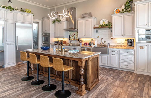 Fort Morgan House | Postcard views from your home equipped with a dream kitchen! Come enjoy luxurious living in a highly sought-after neighborhood in Fort Morgan.