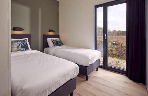 Lattrop House | The Amalia is a four-person holiday home and has an attractive homely living room with an open kitchen, two bedrooms and a spacious outdoor area.