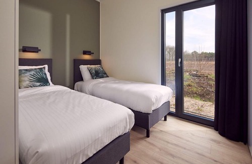 Lattrop House | The six-person holiday villa Amalia with private sauna has a spacious living room, open kitchen, three bedrooms and a spacious patio.