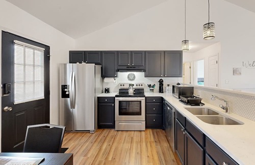 Salisbury House | Perfectly located home with deck, open layout, smart TVs, central AC, & W/D