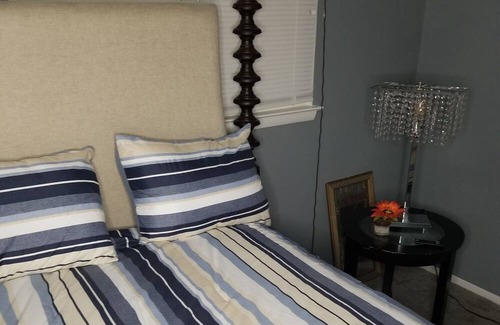 Summit Station House | Cozy Family friendly 4 bedroom house, mins from Downtown with hot tub in bedroom