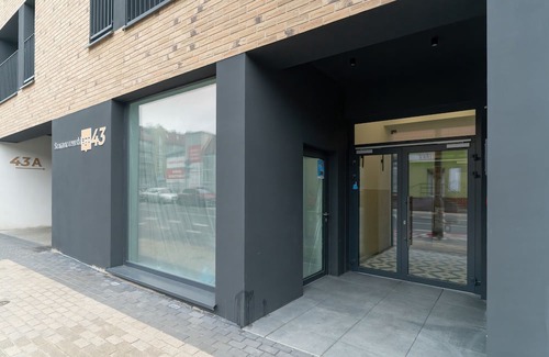 Jezyce Apartment | Dark Grey Apartment in Poznan by Renters