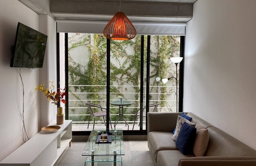 Zona 8 Apartment | Luxury Cayala 2BR/2BA suite w/sunlit balcony near US Embassy, modern amenities.