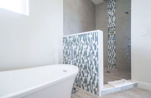 West Bay Condo | 7 Mile Beach views from the Roof terrace. Luxury Condo with Private Beach Club
