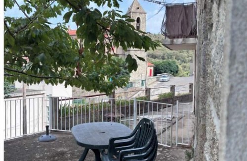 Zicavo House | Village center house with terrace.