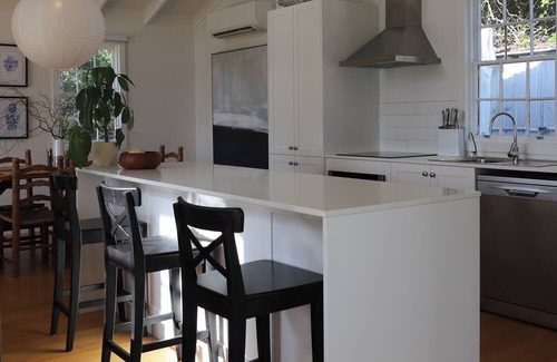 Falmouth House | White Shell Cottage | Wood fire & beachfront