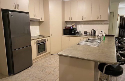 Kirwans Bridge House | Waterfront 4 Bedroom Home with Rumpus Room