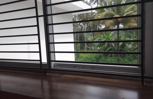 Irinjalakuda Apartment | 2 storied waterfront homestay Thrissur
