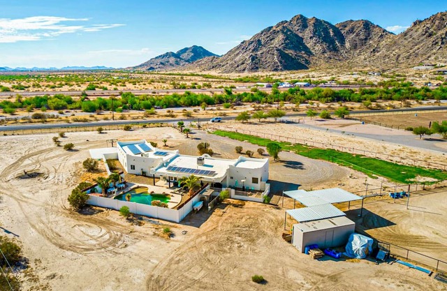 Spacious desert charmer with a pool, covered patio, office, games, AC, and Wifi