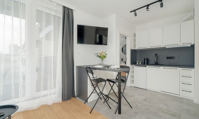 Jezyce Apartment | Dark Grey Apartment in Poznan by Renters